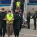 200 suspects who were escorted out of the plane on the scene
