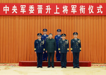 Xi Jinping hands over certificates of order to promote two military officers to general