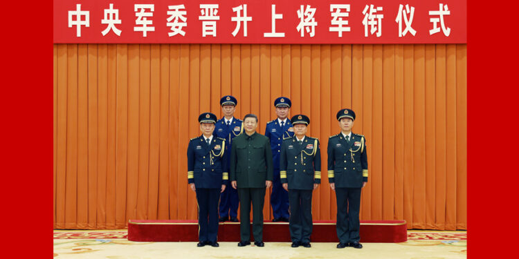 Xi Jinping hands over certificates of order to promote two military officers to general