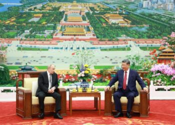Xi Jinping and Vladimir Putin talk over tea in Beijing